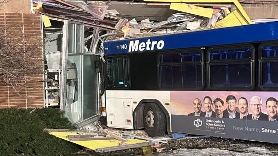 Woman Arrested in Restaurant Bus Crash